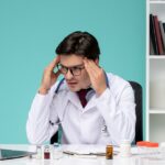 Doctor working remotely representing Stress and Mental Wellness in 2025